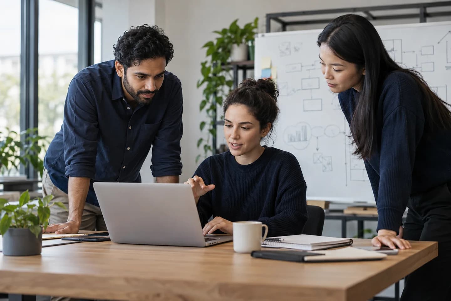 Illustrative software team discussing a client project in their office
